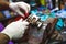ATV hydraulic disc brake caliper system repair by hands in old garage