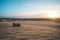 ATV Quad Bike in front of sunrise in the desert. ATV stands in the sand on a sand dune in the desert of Vietnam. MUI ne