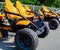 ATV quad bikes stand parked in a park