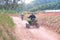 ATV quad motorcycle on a rural forest track next to a sportive motorcycle in a adventure sport activity. Empty copy space