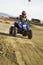 ATV racer on dirt track