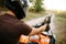 Atv rider adjusts the rearview mirror before trip