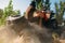 Atv rider climbing the sand mountain, back view