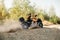 Atv rider in helmet rides on sandy road in forest