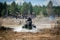 Atv rider in muddy water. Xtreme utv ride