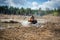 Atv rider in muddy water. Xtreme utv ride