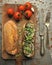 Aubergine and cheese sandwich with tomatoes on a vintage background