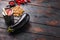 Aubergine penne ingredients eggplant pasta, pepper tomatoe sauce, on old dark wooden table side view space for text