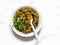 Aubergine spinach vegetarian curry on a light background, top view. Indian cuisine