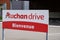 Auchan drive logo brand and text sign shop supermarket grocery retailer store panel