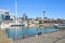 Auckland City Skyline. New Zealand. Unidentifiable People at Water`s Edge