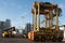 AUCKLAND, NEW ZEALAND - 17 APRIL: Straddle carriers and stack of containers at port of Auckland.