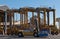 AUCKLAND, NEW ZEALAND - 2 APRIL 2012: 4 straddle carriers and stack of containers at port.