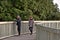 AUCKLAND, NEW ZEALAND - Jul 01, 2019: older couple walking on Half Moon Bay marina walkway at Bucklands Beach