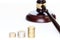 Auction symbol with coins and gavel