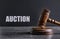 Auction. Wooden gavel on textured table