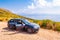 Audi A4 estate automobile stands on the dirt road on the mountains of Cilento and Vallo di Diano National Park in Campania region