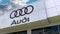 Audi logo on the modern building facade. Editorial 3D rendering