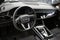 Audi Q7 steering wheel and dashboard. Black leather car interior. Vehicle interior SUV car.