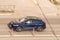 Audi Q8 SUV vehicle on the city road. Fast moving gray car on Moscow streets. Accelerating with low-emission. Compliance with