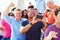 Audience Cheering At Outdoor Concert Performance