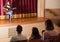 Audience listening to guitar concert