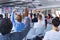 Audience raising their hands in a business conference