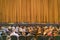 Audience in Theater. closed stage curtain in a theater. blurry