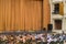 Audience in Theater. closed stage curtain in a theater. blurry