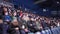 Audience wearing protective masks watches hockey match