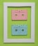 Audio cassettes from 80s in a white frame on a colored green background. Minimalist trend