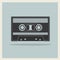 Audio Compact Cassette Tape on Retro Background