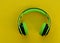 Audio Headphones. Green headphones on a yellow background.