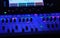 Audio mixer in blue light lamps faders and touchscreen