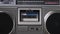 Audiocassette Rotates in Deck of an Old Tape Recorder