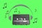Audiotape and headphone draw on green