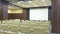 Auditorium with chairs and blank screen, panorama