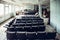 Auditorium room with chairs in abandoned and ruined industrial factory, creepy aged building after war, no people