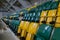 The auditorium in the sports complex with green and yellow plastic seats. Places for spectators of a sports match indoors. The