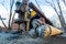 Auger from Hydraulic ground water hole drilling machine installed on the old truck with big wheels on the construction site.