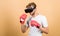 Augmented 3D world. Cyber sportsman boxing gloves. Man play game in VR glasses. Cyber sport concept. Man boxer virtual