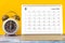 The August 2023 Monthly desk calendar for 2023 year and alarm clock