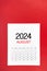 A August 2024 calendar page with push pin on red background