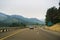 August 21, 2017 Azalea/OR/USA - Driving on the interstate on a summer day when smoke covers the hills and mountains