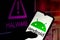 August 25, 2021, Brazil. In this photo illustration the Android logo displayed on a smartphone with malware alert in the