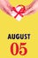 August 5th. Festive Vertical Calendar With Hands Holding White Gift Box With Red Ribbon And Calendar Date