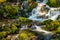 august river over rocks with moss growing