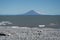 Augustine Island, an active volcano as seen from a beach covered