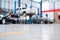 Auomobile repair, Car service centre auto repair body paint workshop blurred background. Car repair service center. epoxy floors