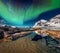 Aurora borealis above Haukland beach, Norway, Europe